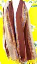 Womens clothing outwear wholesale distributor. Brown and tan colored shawl wrap with colored stripe designs and tasseled hem