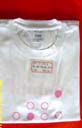 Girls apparel fashion distribution export echange. Cute white t-shirt with pink circle designs